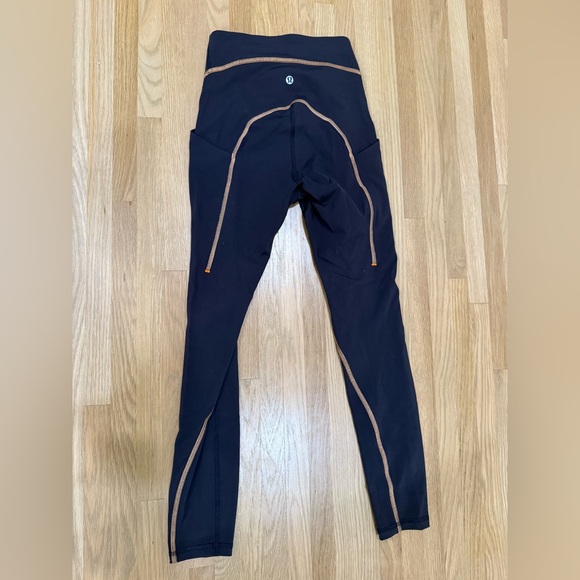 Lululemon base pace Black Leggings with Orange Accents - Picture 1 of 5
